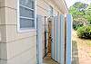 The outdoor shower features hot and cold water and is private.  A beach pleasure- showering outside!
