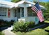 This is the front yard and screened/ glassed in front porch. Ground level cottage makes this very easy to get around.