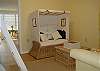 The Bunk room also features a set of twin bunkbeds and additional seating area.