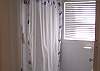 The full bath has a shower/ tub and window that over looks the back garden and marsh