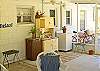 Screened porch include bar and mini refrig in addition to lots of seating