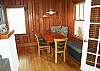 The dining room table seats 6 people including the banquette. The original light fixture hangs above the dining room table.  Cozy and ideal to eat or play a board game with your family.