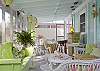 Vintage Heaven in pink and green! A glider full of barkcloth pillows. White Wicker everywhere you look! We adore this screened porch!!!