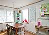 Dining table with seating for 8. Fun blue/white polka-dot chandelier!