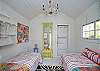 The back cottage is a little haven. Great for lounging or kids that want to "glamp" (glamour camp!) Two twin beds, AC, bright and cheerful local art and unique cottage decor.