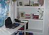 The office and libray sits between the master bedroom and bath and the TV room. The window looks out to the side yard and garden and is completely light filled!