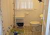 The full bathroom is very bright and cheerful!
