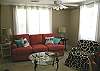 Can you see all of the fun touches? The parrot pillows, the animal print cotton slipcovers? The windows have beautiful IKEA cotton curtains to let the sunshine in yet give you the privacy.