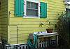 The back yard features a charcoal grill, Gas Grill , hot and cold water shower, fish cleaning table and small brick patio seating area. The entire yard is surrounded by beautiful gardens featuring native plants.