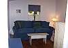 A wonderfuly comfy room to watch tv, relax or use as a third bedroom