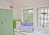 This is the seating area between the two bedroom areas.  This is like a tree house- beautiful view of the live oaks from a birds eye view!