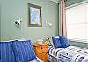 This bedroom has two twin beds as well as cable TV.