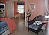 This bedroom has plenty of room to not only sleep, but to relax and have some extra privacy.