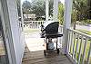 To the left of the front doors is  the gas grill  and all of the BBQ tools you need.