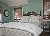 The queen bedroom is on the 2nd floor and has cable TV. The master bathroom on the 2nd floor is also off this bedroom. The bedroom has one queen bed and one twin bed.