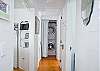 View of hall and laundry. Cottage is equipped with stacking washer/dryer.