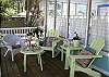 The porch features lots of seating and areas to relax.