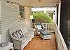Seating on screened porch.