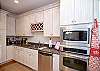 This is Paula's kitchen so you know it's going to be outfitted with everything you need. Stainless steel major appliances, granite countertops, and wonderful white-washed cabinets filled with glassware, china and service ware. Small appliances include blender, mixer, microwave, and a coffee maker, of course!
