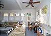 This is the former screened porch that has been fully-enclosed and is now a separate sitting and dining area.