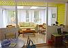 The living room leads right to the dining room area. This area also features a desk with the complimentary high speed and wifi internet service