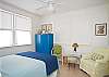 Another view of second bedroom with queen bed. All the bedrooms have large windows giving each room lots of natural light.