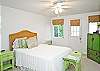 Queen bedroom with our wonderful green colors in the room. We have cable tv in each of the bedrooms. There is also a door to the back garden and fully fenced in backyard.