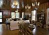 Large pine farm table offers seating for eight , formal or casual either works