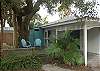 The outdoor deck sits beneath the 200 year old Live Oaks. The cottage also features an outdoor shower with hot and cold water! Yard is completely fenced in.