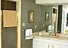 Private shower and oversized whirlpool bath tub make the master bathroom an ideal vacation treat!