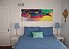 This bedroom features a queen sized bed.