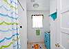 This is the full bath; this bathroom is located between the 2 bedrooms.