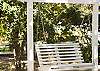 Maddie's sits in between two lots ( a very rate occurance on Tybee!) and the lot to the right of the cottage features a picnic table, outdoor seating and a swing.