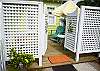 The patio leads to the outdoor shower with hot and cold water