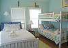 Bedroom 2 features a double bed and bunk beds.