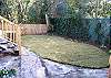 The back yard is fully fenced with back door entrance to the home.