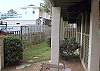 The Side yard of the home- the entire side and back yard is fenced in.