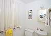 The cottage features two full bathrooms. They each have a shower.