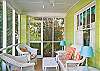 Another view of the great screened porch!  Imagine evening cocktails or curlilng up with a good book here!