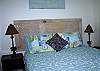 The Conched Out bedroom features 1 queen bed. An old Tybee door is your headboard! Yet another fun touch in this great cottage. The sign above is from one of our local artists which reads TYBEE!