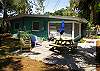 The back yard includes the Grill, patio, large fenced in yard and patio and picnic table.