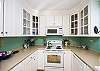 Another view of the bright, spacious kitchen.