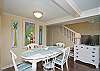 The first floor living room area is a combination of the living room with sofa and cable TV, dining room area with table that seats 6 people.