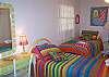 Another view of Bedroom 2 with the three beds.