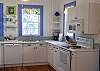 the kitchen is full of sunlight! The entire house has the orginall heart of pine floors