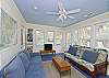 The sun room has three walls of natural light for a bring and cheerful room. We also have our books and games in this room