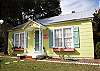Maddie's sits in the middle of two lots full of 200 year old Live Oak trees and many palms. The home is also beside Flip Flop Cottage and Mimosa Cottage- ideal for several families to gather together!