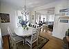 This picture is the dining room looking toward the living room.  This table will seat 6, and just beyond the doors is the picnic table that will seat 6 to 8 guests.