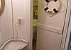 Every part of our cottage is beachy- including the door to our new 1/2 bath!