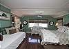 The queen bedroom is on the 2nd floor and has cable TV. The master bathroom on the 2nd floor is also off this bedroom.  The bedroom has one queen bed and one twin bed.